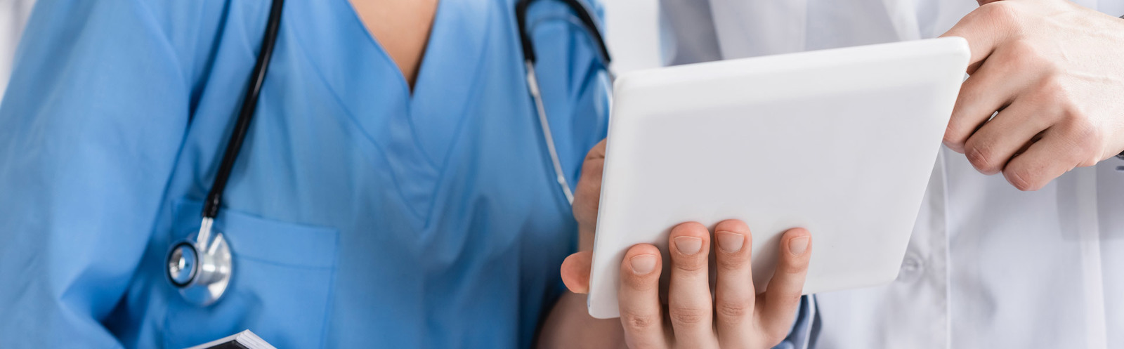 doctors looking at a tablet