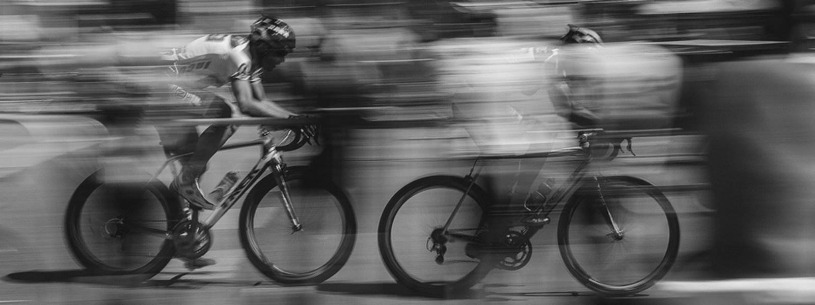 Runners whizzing by bike